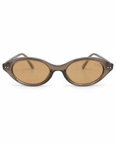 Óculos de sol feminino oval modelo Valleny LURVANI, com armação marrom translúcida e lentes marrons, vista frontal em fundo branco.